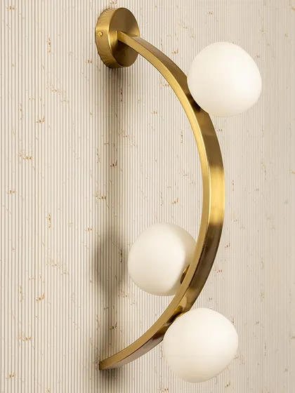 For a clean, contemporary look, I often recommend this Triple Globe Wall Light. The combination of a sleek gold frame and soft opal globes provides a balanced, ambient glow. It works beautifully in pairs in a hallway or as a sophisticated bedside light.