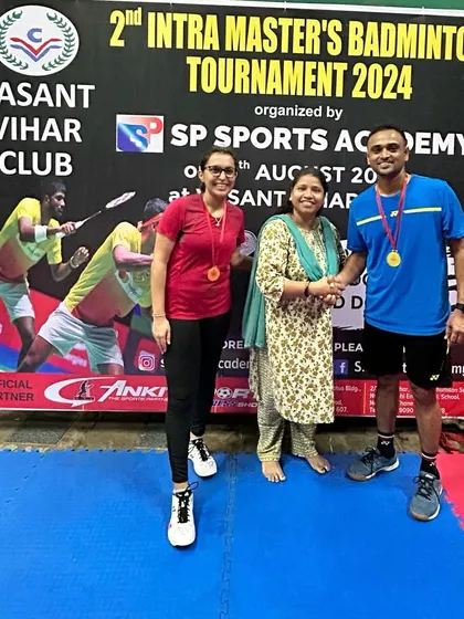 Runners-up of the Mixed Doubles Group C & D, Omkar and Gayatri, receiving their medals.