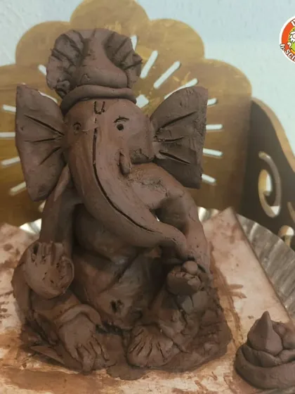 A finished clay Ganesha, ready to be welcomed home. Our workshops provide all the materials and guidance needed to create a beautiful idol.