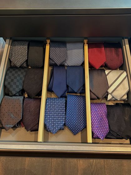 A drawer dedicated to a tie collection. We used simple dividers to create a custom rack, ensuring each tie is visible, protected, and ready to complete a formal look.