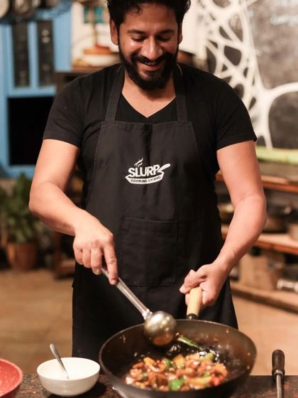 A happy chef in his element, sharing his knowledge and passion with students.