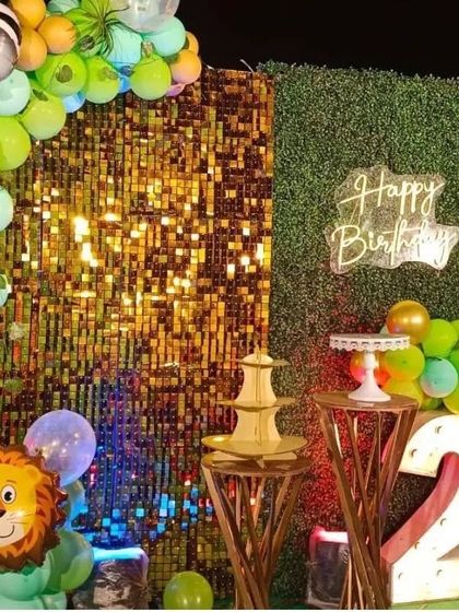 Another angle of the jungle safari birthday decor, showing the lion foil balloon and the illuminated number '2'. We ensure every element, from the backdrop to the props, fits the adventurous theme.