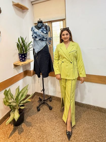 Posing next to a mannequin I styled during my workshop. This lime green co-ord set is a testament to how the right cut and color can create a powerful and memorable look.