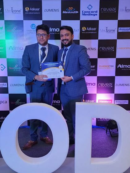 Receiving recognition for my participation and discussion on laser hair removal technology at the SODC conference.