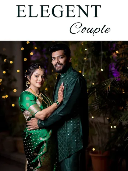 An elegant couple portrait against a backdrop of fairy lights, with the bride in a beautiful green saree.