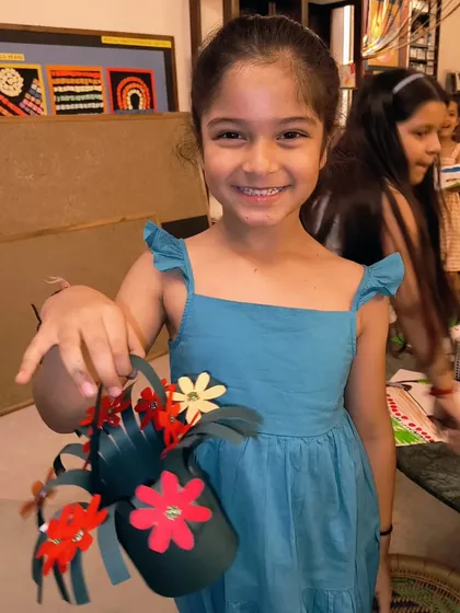 Another happy student with her handmade Mother's Day flower basket. These projects are a great way for them to express their gratitude.