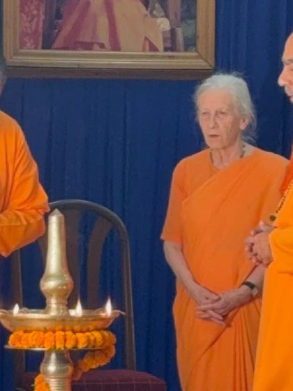 The ceremonial lighting of the lamp, a ritual that symbolizes the dispelling of darkness and the welcoming of divine light and knowledge. These moments are filled with grace and peace.