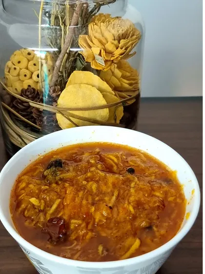My sweet and tangy Aam ki Chutney, made from grated raw mangoes. I cook it slowly with spices until it has the perfect jam-like consistency. It is made without any vinegar or artificial preservatives.