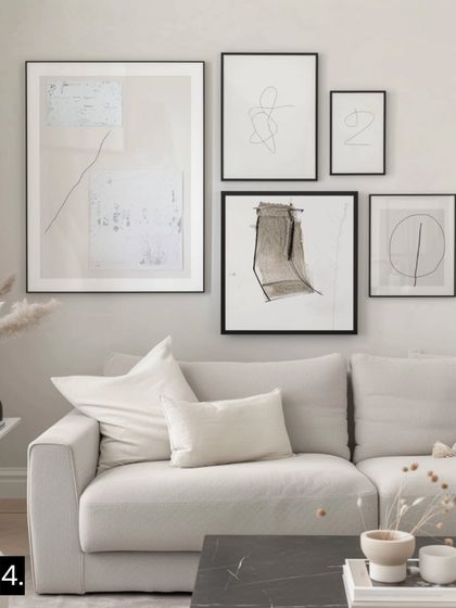 For a Modern Luxe aesthetic, we combine elegant black frames with minimalist and abstract line art. This creates a refined, sophisticated look that feels both chic and inviting.