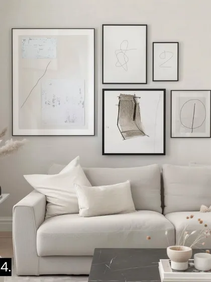 For a Modern Luxe aesthetic, we combine elegant black frames with minimalist and abstract line art. This creates a refined, sophisticated look that feels both chic and inviting.