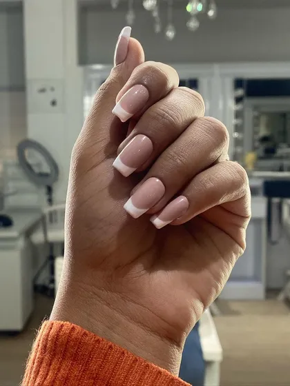 You can never go wrong with a classic French manicure. I focus on creating a clean, crisp smile line and a perfect nude base for a timeless look, shown here on well-structured square-shaped gel extensions.