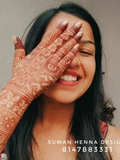 For me, art is a profession of spreading happiness. Seeing my clients smile like this with their finished henna stain is the best part of what I do.