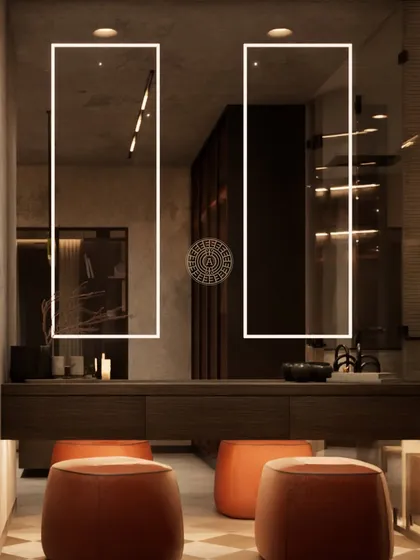 A vanity area within the walk-in closet, featuring two backlit mirrors and bright orange stools for a pop of color. The design is modern, functional, and full of personality.