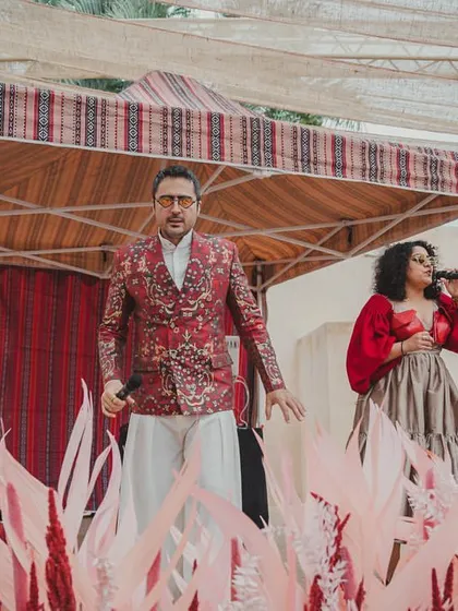 Another shot of the live performance, set against a backdrop of desert-inspired decor.