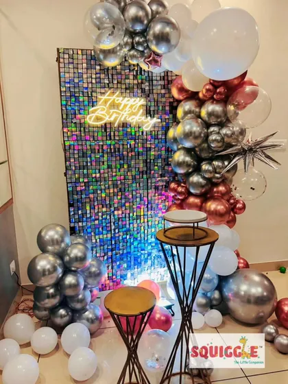 A full view of the holographic shimmer wall and balloon setup, showing how it transforms a space.