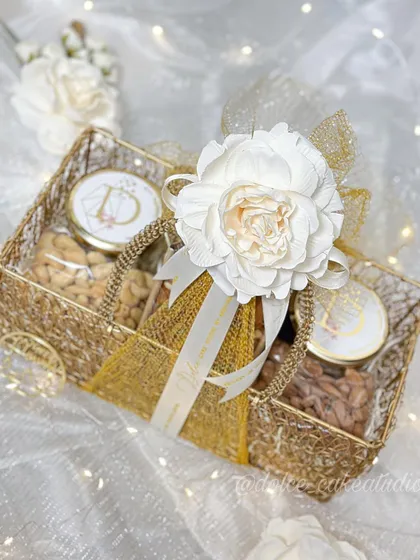 This beautiful mesh basket hamper is one of my signature Diwali gifts. It’s filled with a mix of my handmade, eggless tea cakes and jars of savory roasted nuts, all packed with care and decorated with a reusable flower. It’s a perfect, complete gift for the festive season.