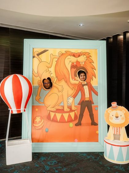 A fun, interactive photo-op for a circus party. This large, framed cutout lets guests become part of a classic lion tamer scene.