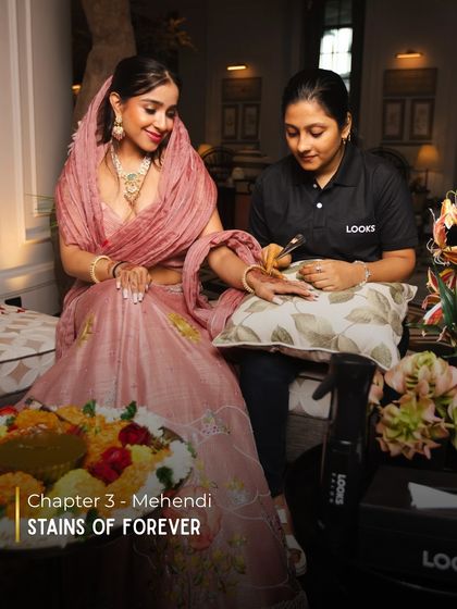 During the Mehendi, I ensure the bride is comfortable while looking her best. This includes coordinating her makeup and hair with her outfit and ensuring her nails are perfectly manicured to frame the intricate henna designs.
