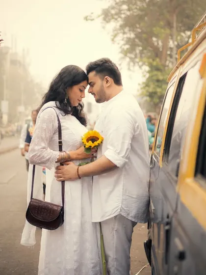A quiet moment of connection on a busy Mumbai street, proving that love can create a peaceful bubble anywhere.