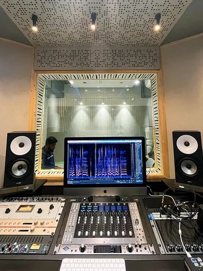 Another view of our control room, showcasing the professional setup and acoustically treated environment where you'll bring your music to life.