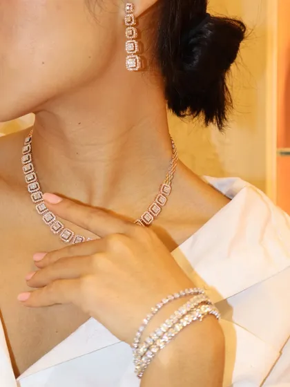 The TMJ Diamond Set, featuring a necklace, earrings, and bracelet, each crafted to perfection with a modern square-link design.