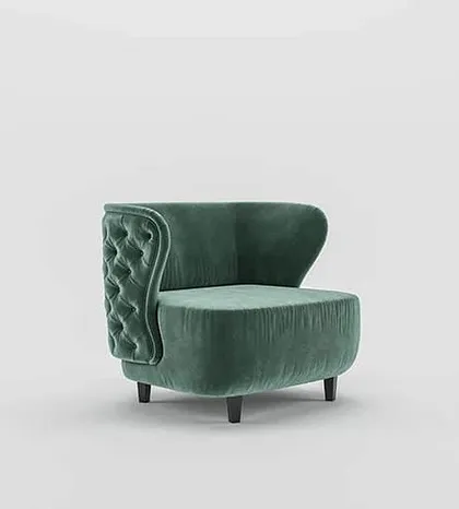 This angle highlights the unique, asymmetric wingback design of our tufted armchair, a modern twist on a classic silhouette.