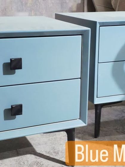 Add a pop of colour with custom-painted furniture. This pair of two-drawer side tables in a lovely powder blue finish comes with simple black hardware and legs.