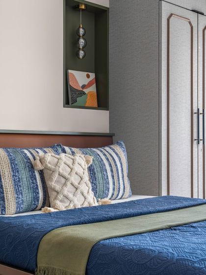 Another view of the grandparents' bedroom, highlighting the built-in niche with a pendant light, which serves as a perfect spot for a piece of art.