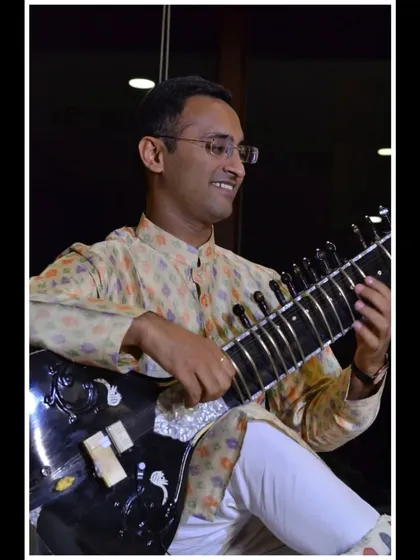 A close-up from a private evening performance, with soft lighting creating a warm and inviting atmosphere.