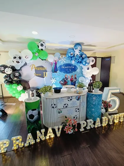A wide shot of the Frozen and football party, including the personalized light-up names.