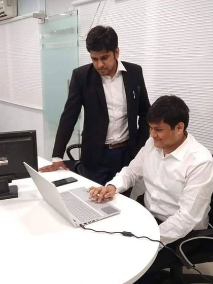 Collaborating with a colleague in our New Delhi office. Teamwork is the pillar of my practice.