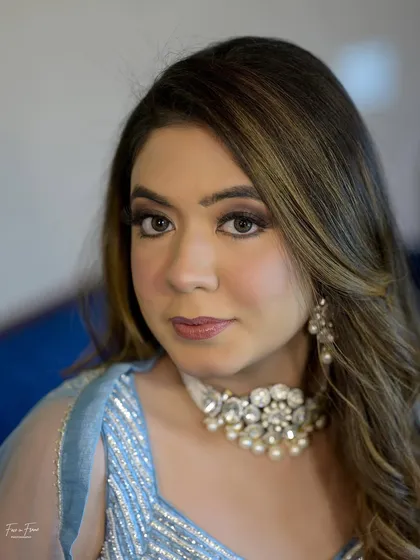 A final portrait. The makeup is timeless and elegant, perfect for any special occasion.