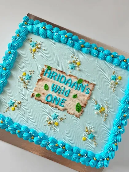 This is the matching sheet cake that was created to accompany the AI-inspired jungle animal cake, ensuring all the guests at the large party got a delicious slice.