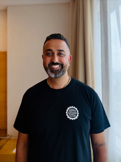 A happy client. Radhika Dasa smiling after his pre-concert grooming session.