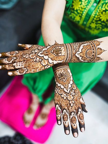 A crossed-hands pose to show the symmetry of the design and the richness of the stain.