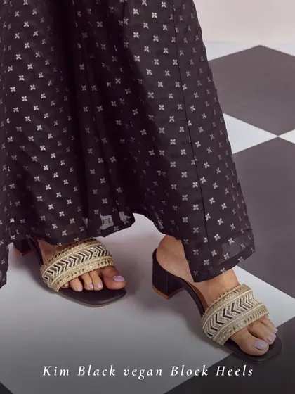 The Kim Black Vegan Block Heels are a versatile addition to your wardrobe. The chevron-patterned beadwork on the strap adds a modern ethnic touch, perfect for pairing with dark-toned festive outfits.