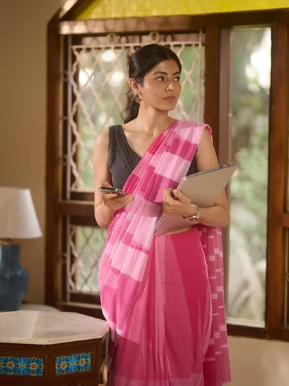 A slightly more formal office look for a saree brand. The makeup is clean and defined, paired with a neat, tied-back hairstyle to convey a sense of modern professionalism.