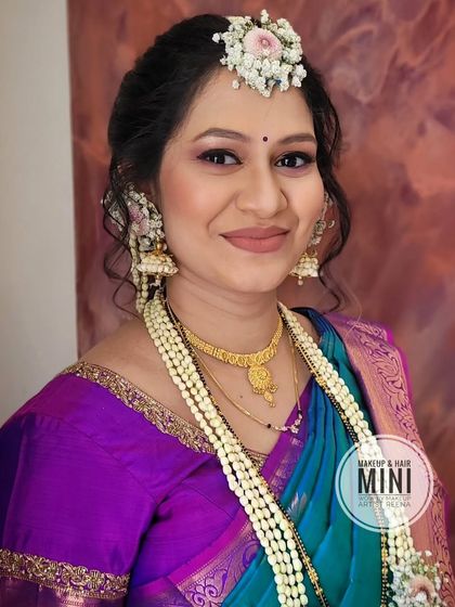 A full view of the baby shower look, showcasing the beautiful saree and the intricate floral jewellery.