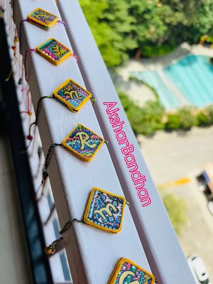 Another beautiful shot of the 'AksharBandhan' Rakhis lined up. I love how the colors and patterns come together to create something so special and personal.