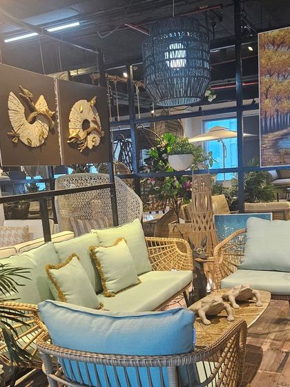 This light blue sofa set brings a refreshing pop of color. The wicker design and plush cushions make it an inviting option for any terrace or garden.