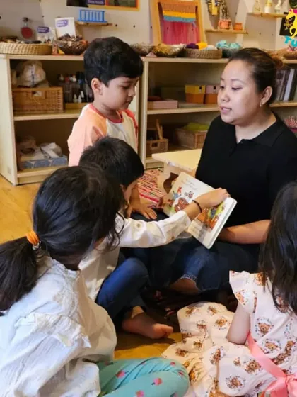 An instructor leads a story time session for a captivated audience.