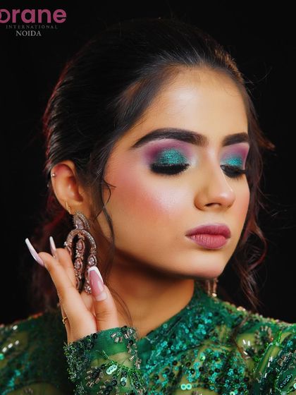 A beautiful shot focusing on the blended eye makeup and the soft curls framing the face.
