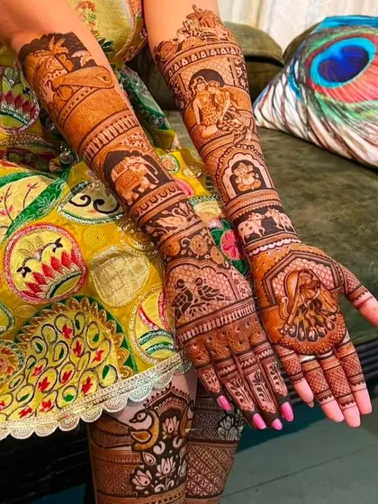 This full bridal mehndi set includes designs on both hands and feet, featuring Ganesha, elephants, and a bride in a doli.