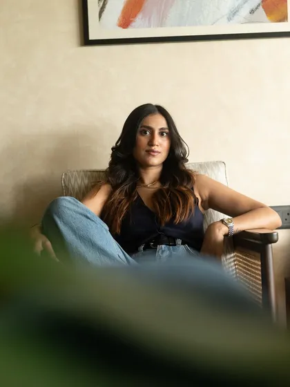 A relaxed, seated portrait that feels both casual and composed. We used the natural elements of her environment to make the photos feel authentic to her brand.