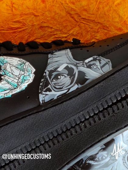 A close-up of the Heisenberg portrait on the Breaking Bad custom Air Force 1s. The detail captures his intense, calculating stare.