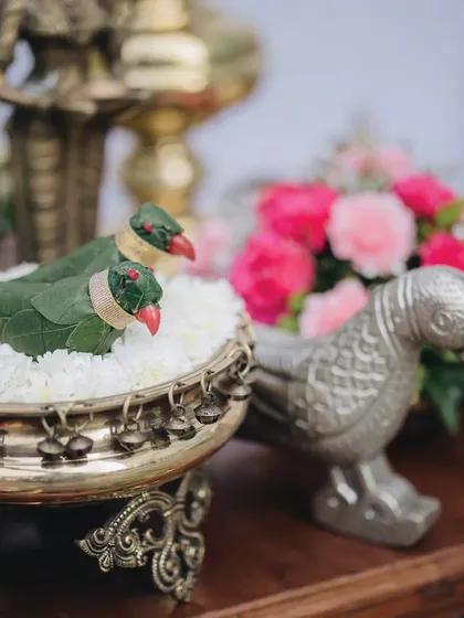 Personalization is at the heart of what we do. For this Muhurtham, we incorporated playful parrot accents into the decor, a detail inspired by the bride's saree border, showcasing how we weave our client's story into every element.