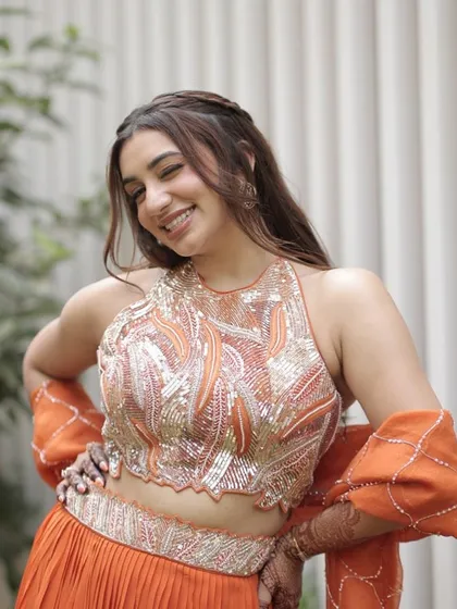 A joyful shot of the bride-to-be at her God Dhana ceremony. The makeup is fresh and vibrant, designed to last through all the festivities while looking effortlessly beautiful.