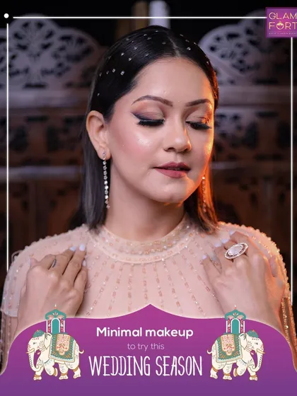 Minimal makeup can also make a big impact. This look focuses on flawless skin and a sharp winged liner, perfect for a sophisticated wedding guest.