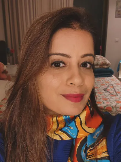 Scarf season is my favorite time of the year. A vibrant scarf is an easy way to enhance your beauty and style. Here, I'm wearing a colorful piece that instantly brightens up a simple blue top.