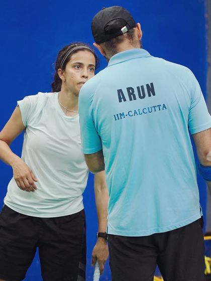 A moment of strategic discussion between points. It's not just about hitting the shuttle; it's about teamwork and communication, skills that are directly transferable to the workplace.